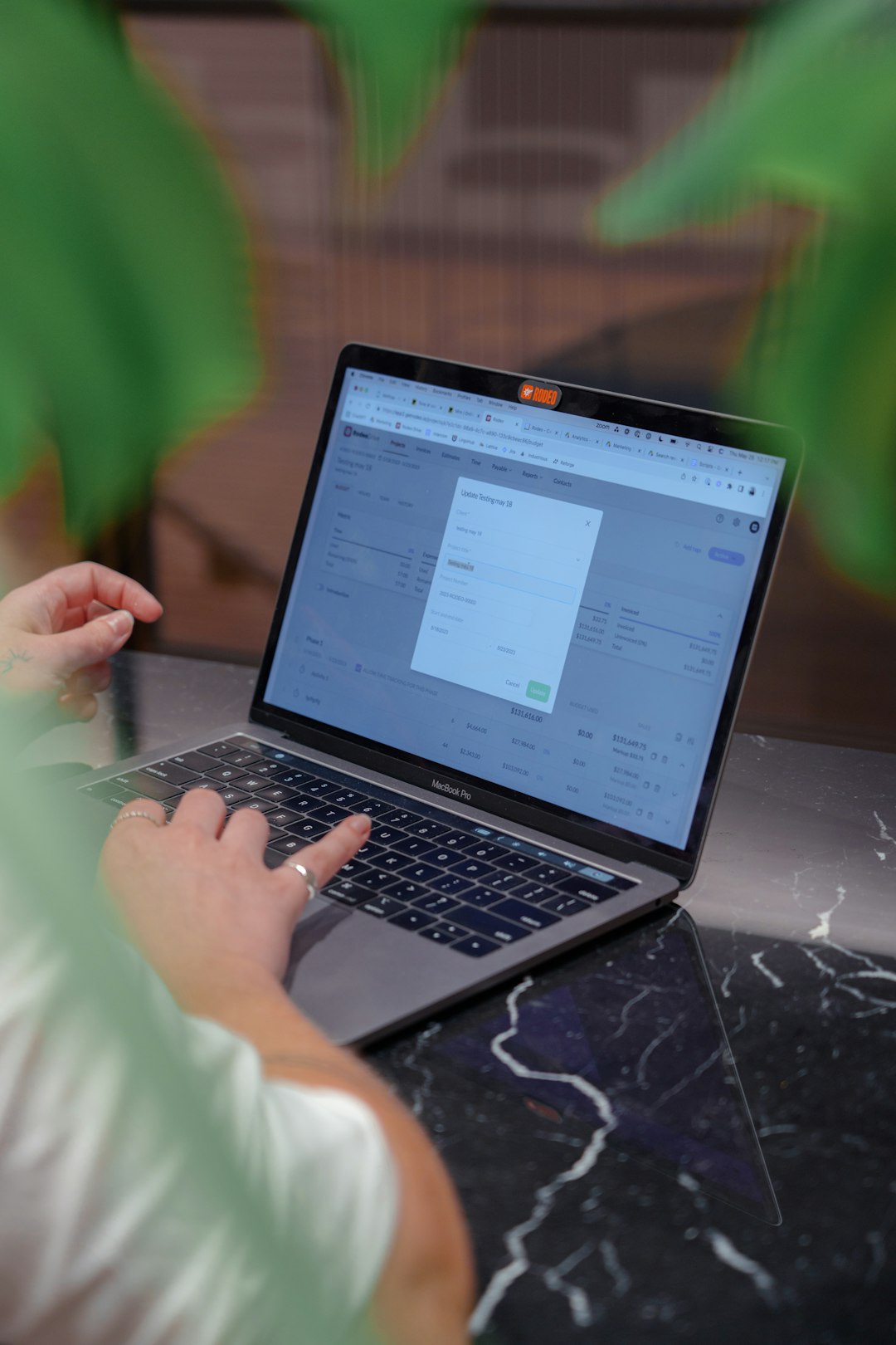 A person comparing different broadband plans on a laptop